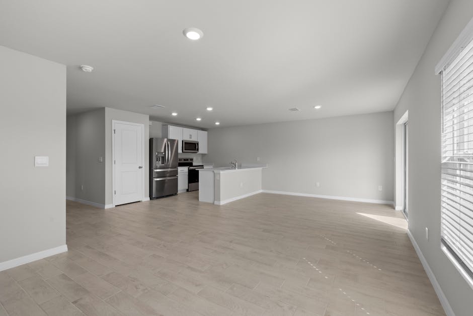 Open-concept kitchen and living area in a new North Loop apartment, with panoramic windows - new apartments in minneapolis Open-concept kitchen and living area in a new North Loop apartment, with panoramic windows - new apartments in minneapolis