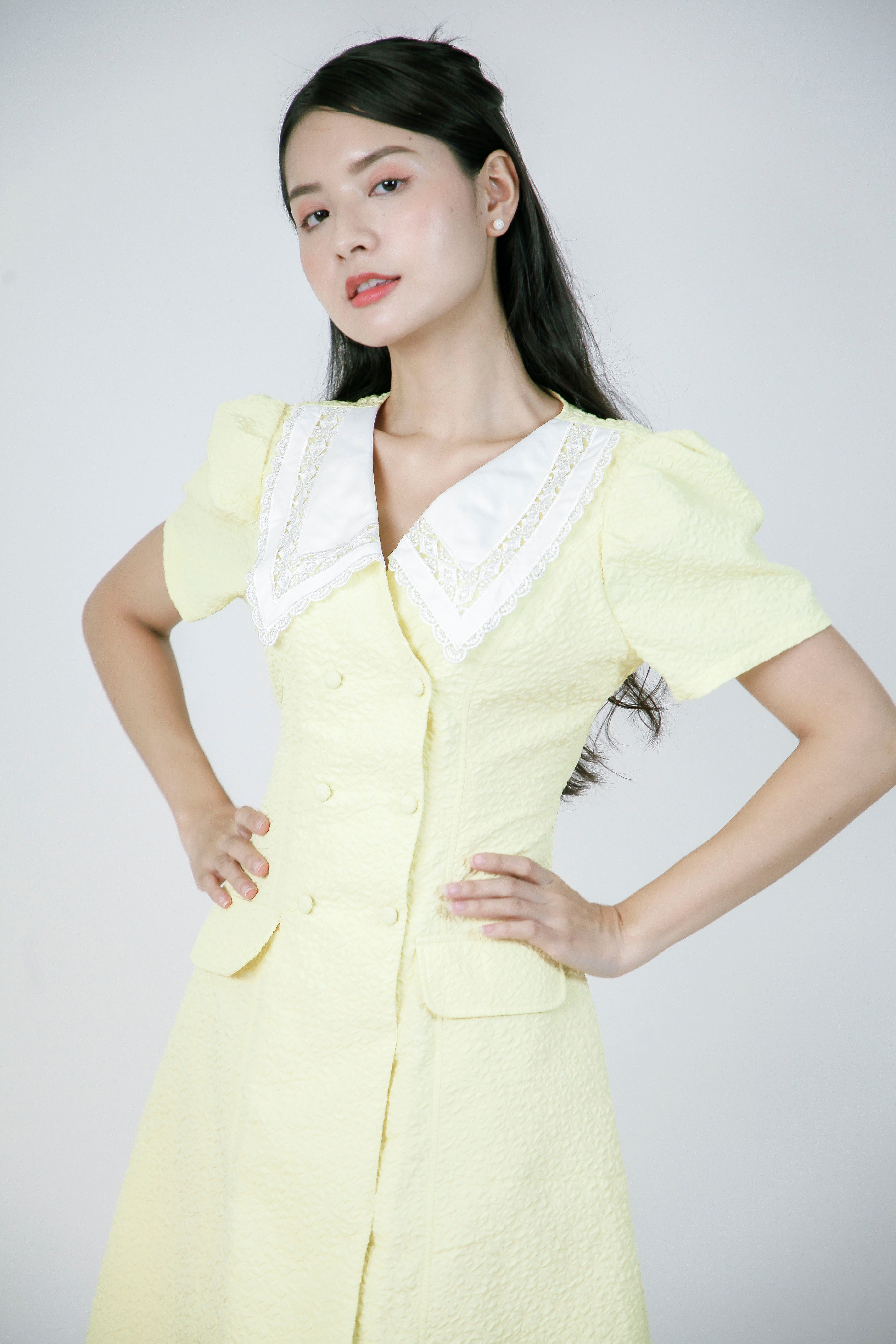 Elegant Woman in Yellow Dress Standing Confidently · Free Stock Photo
