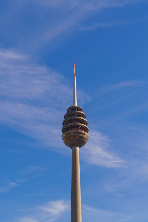 Free The Stuttgart TV Tower stands tall against a vivid blue sky, showcasing modern architecture. Stock Photo