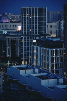 Night view of Astana's skyline showcasing modern architecture and city lights.
