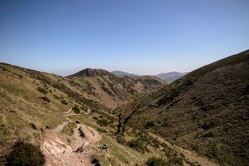 Free Beautiful mountain landscape with panoramic views and hiking trails under a clear blue sky. Stock Photo