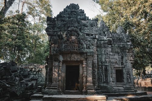 Free Stunning view of ancient temple ruins at Angkor Wat surrounded by lush greenery in Siem Reap, Cambodia. Stock Photo