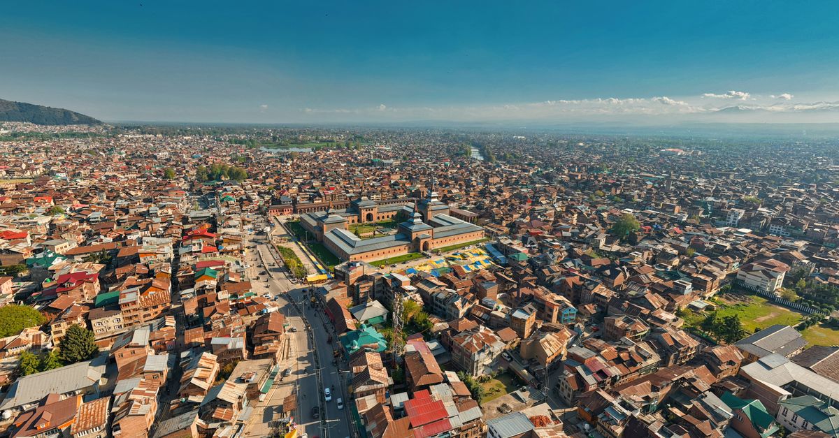 Explore an aerial perspective of Srinagar, showcasing the historic Jamia Masjid amid vibrant city life.