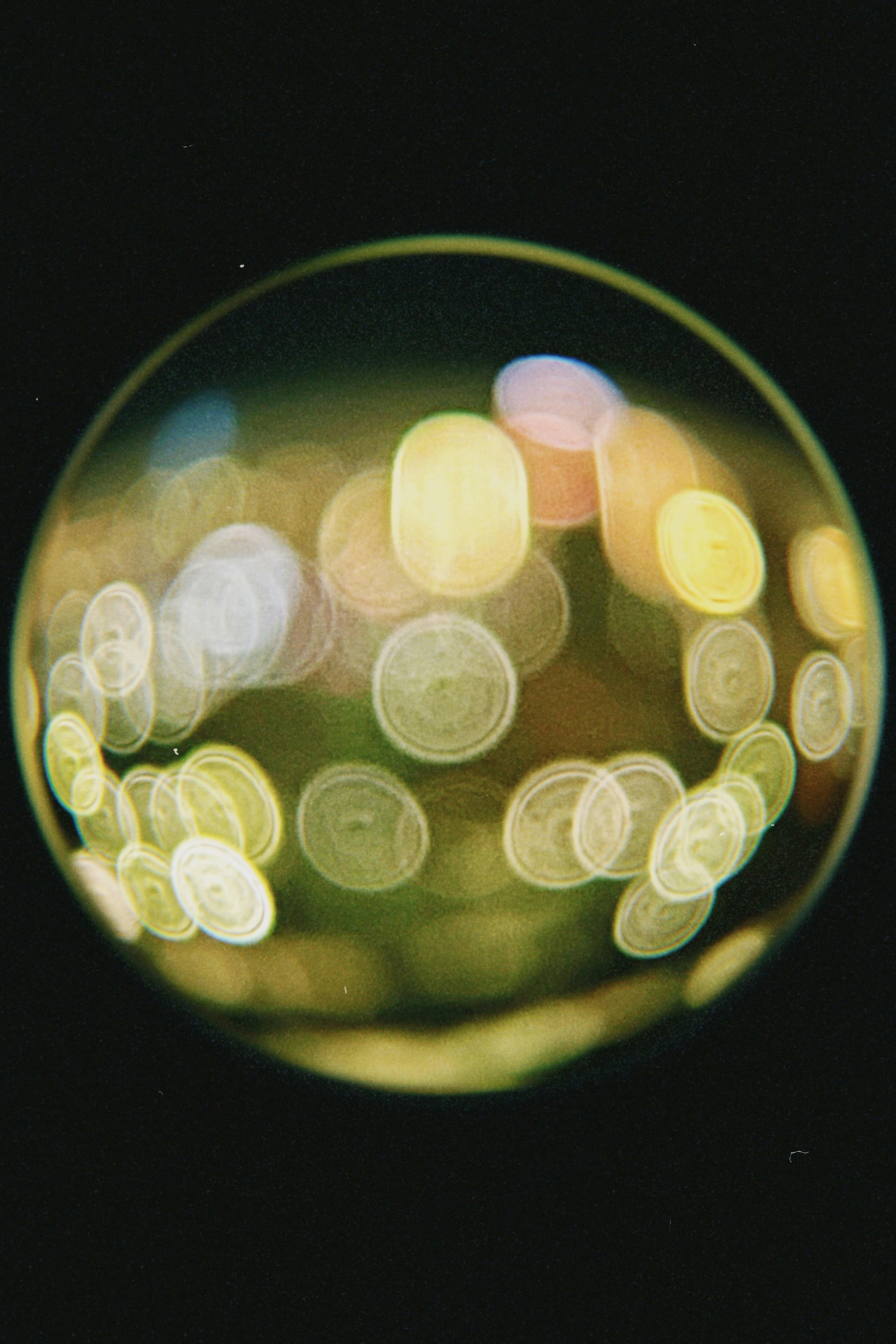 Vivid bokeh lights captured through a fisheye lens in Astana, Kazakhstan.