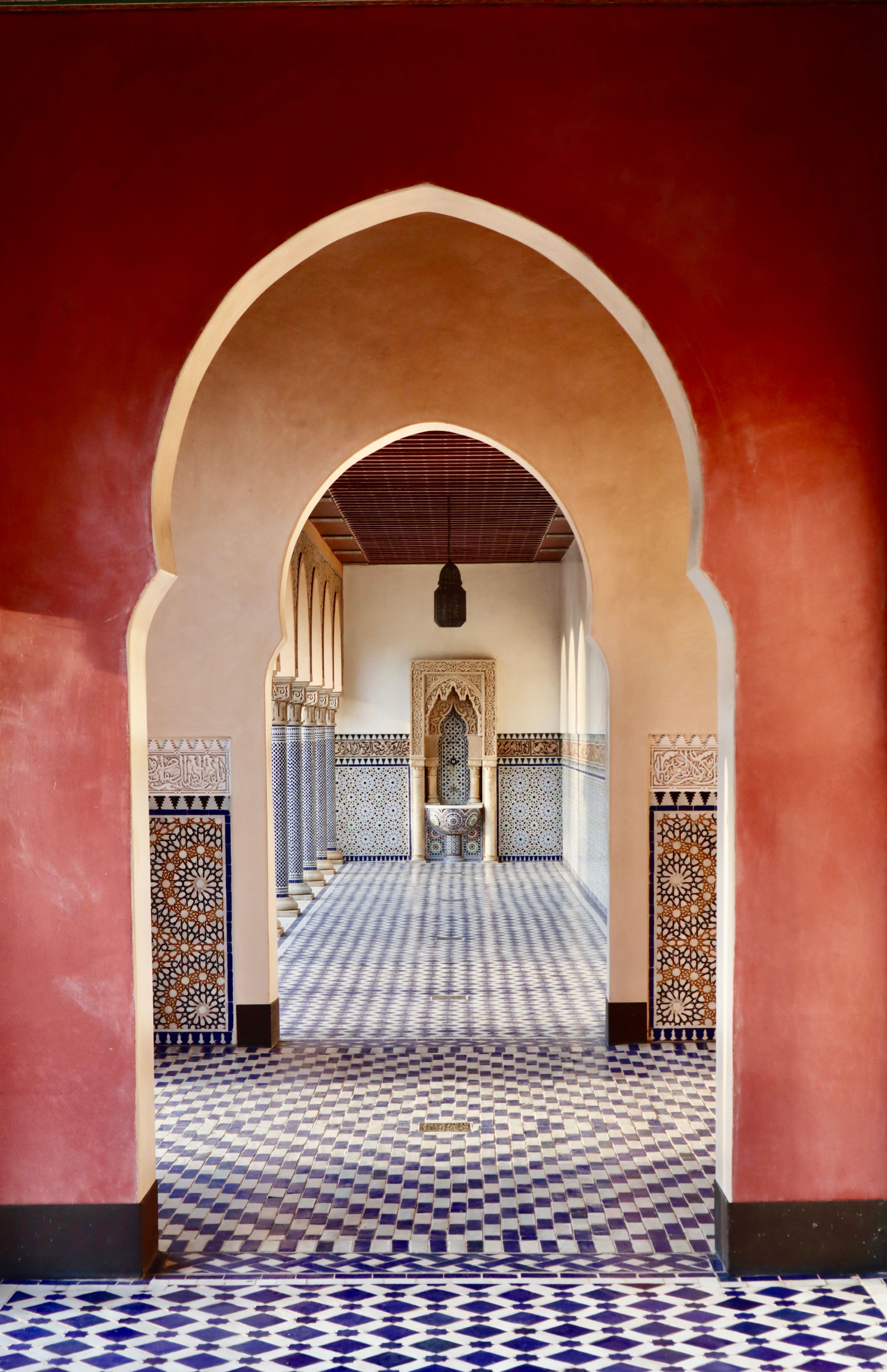 Explore an oriental-inspired mosaic corridor in Berlin's Gardens of the World, showcasing stunning symmetry.