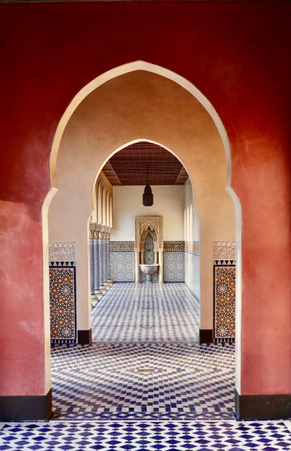 Explore an oriental-inspired mosaic corridor in Berlin's Gardens of the World, showcasing stunning symmetry.