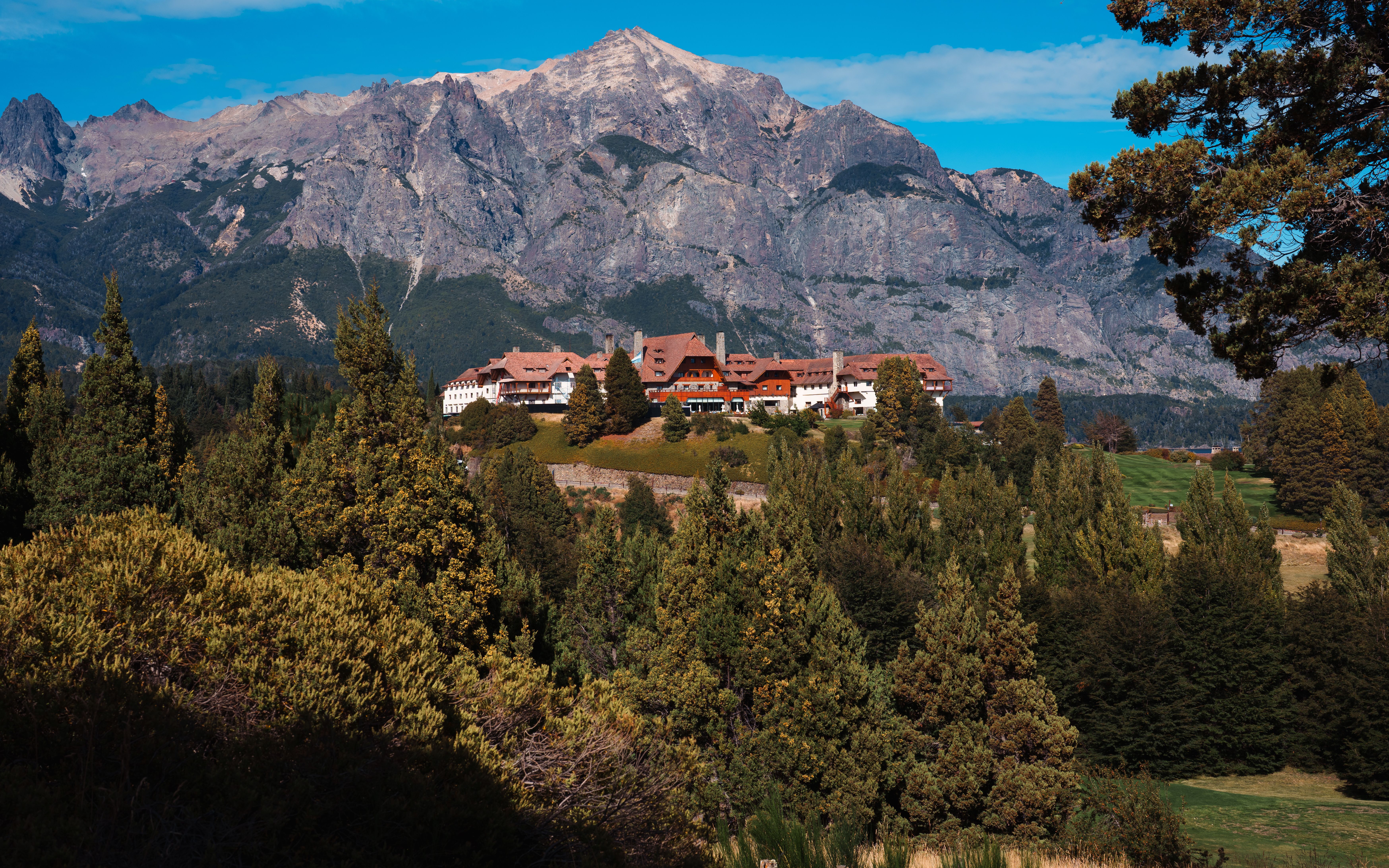 Scenic landscape of Hotel Llao Llao against Andes mountains in Bariloche, Argentina.
