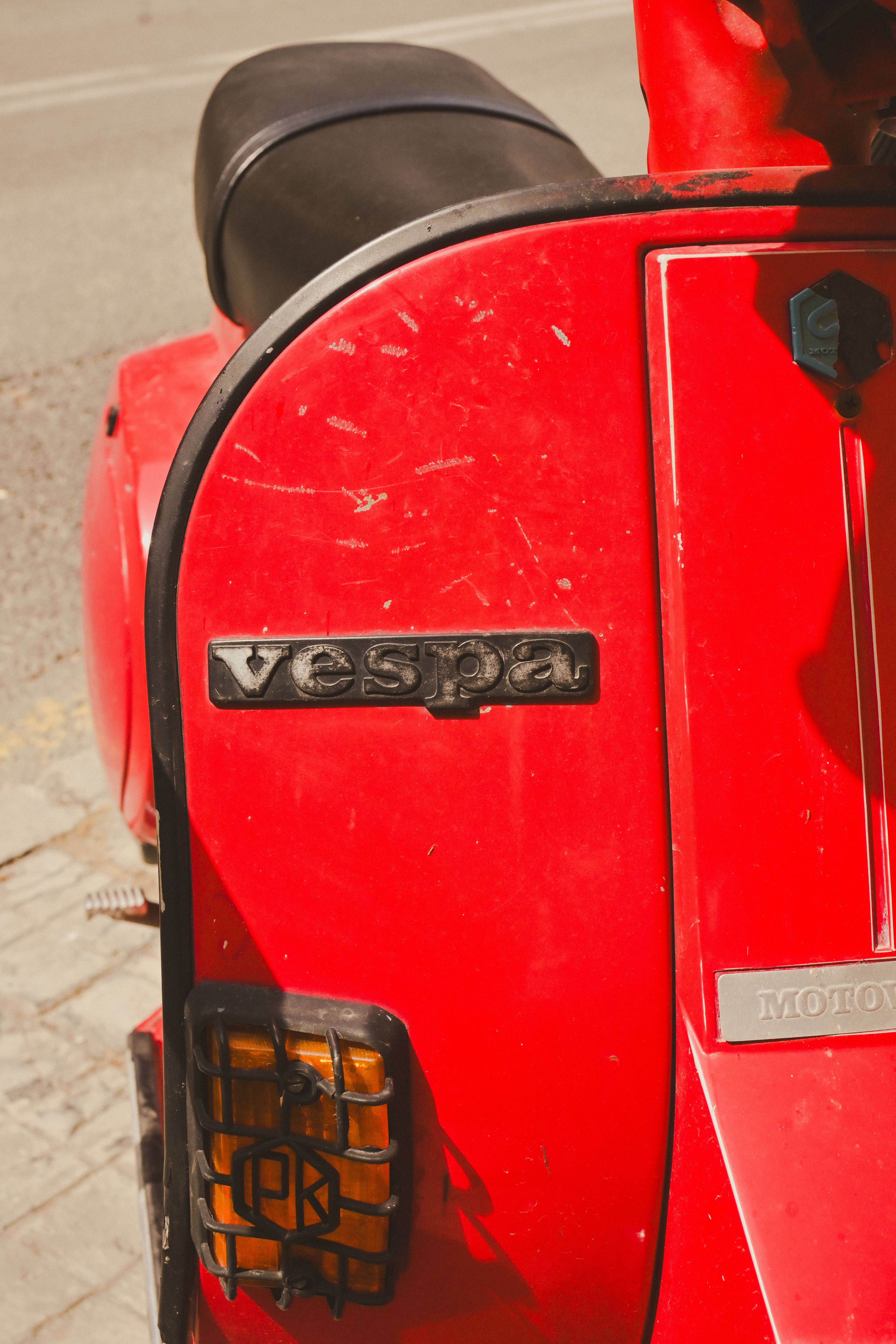 Close-Up of a Red Vespa Scooter's Rear · Free Stock Photo