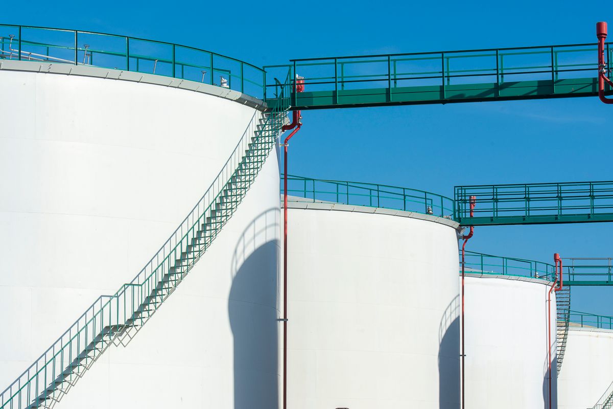 Industrial storage tanks with a walkway