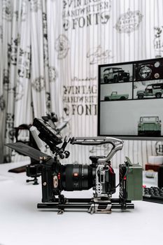 High-end camera rig with monitor in a studio setting, perfect for filmmaking and photography.