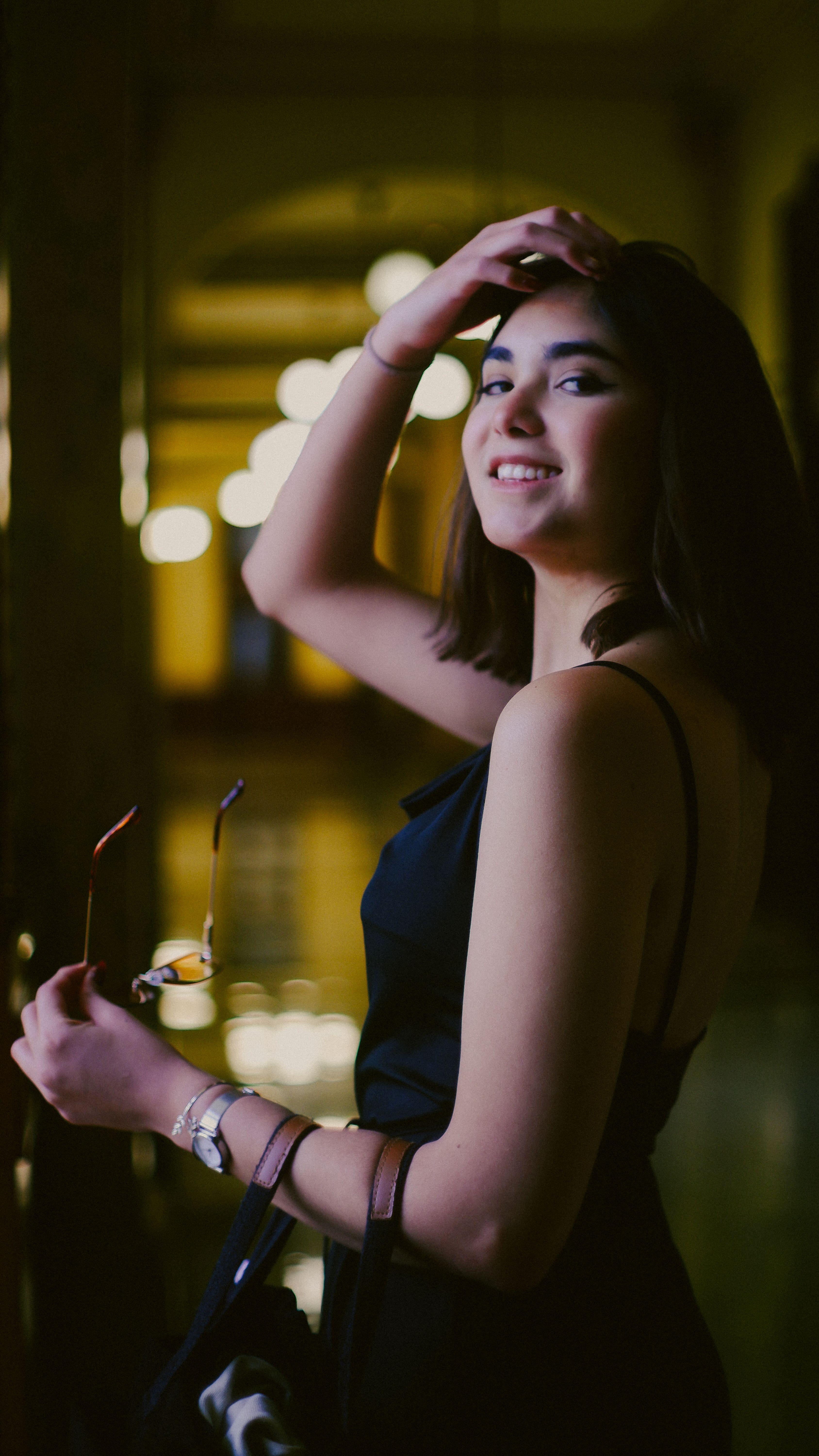 Elegant Young Woman in Black Dress Smiling · Free Stock Photo