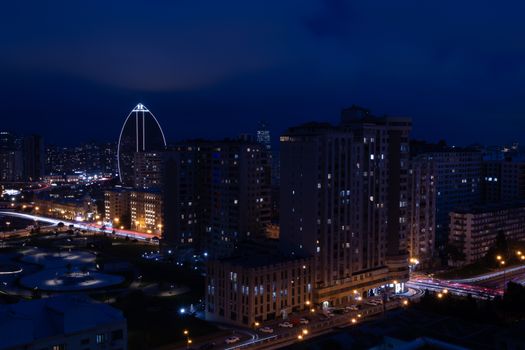 Stunning night view of Baku's skyline with city lights and iconic architecture.
