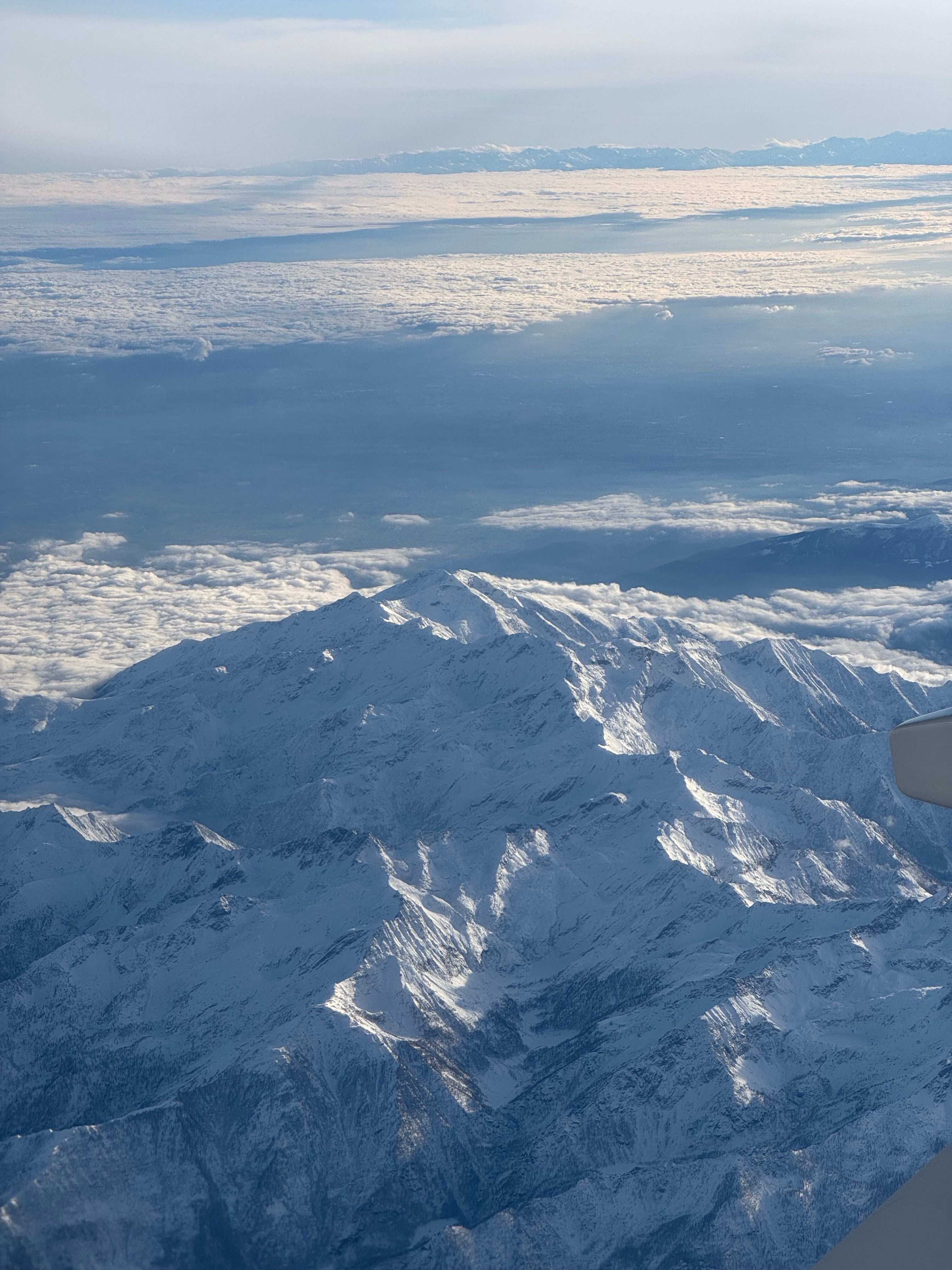 Aerial view of a snow-capped mountain range — photo by Earth Photart on Pexels