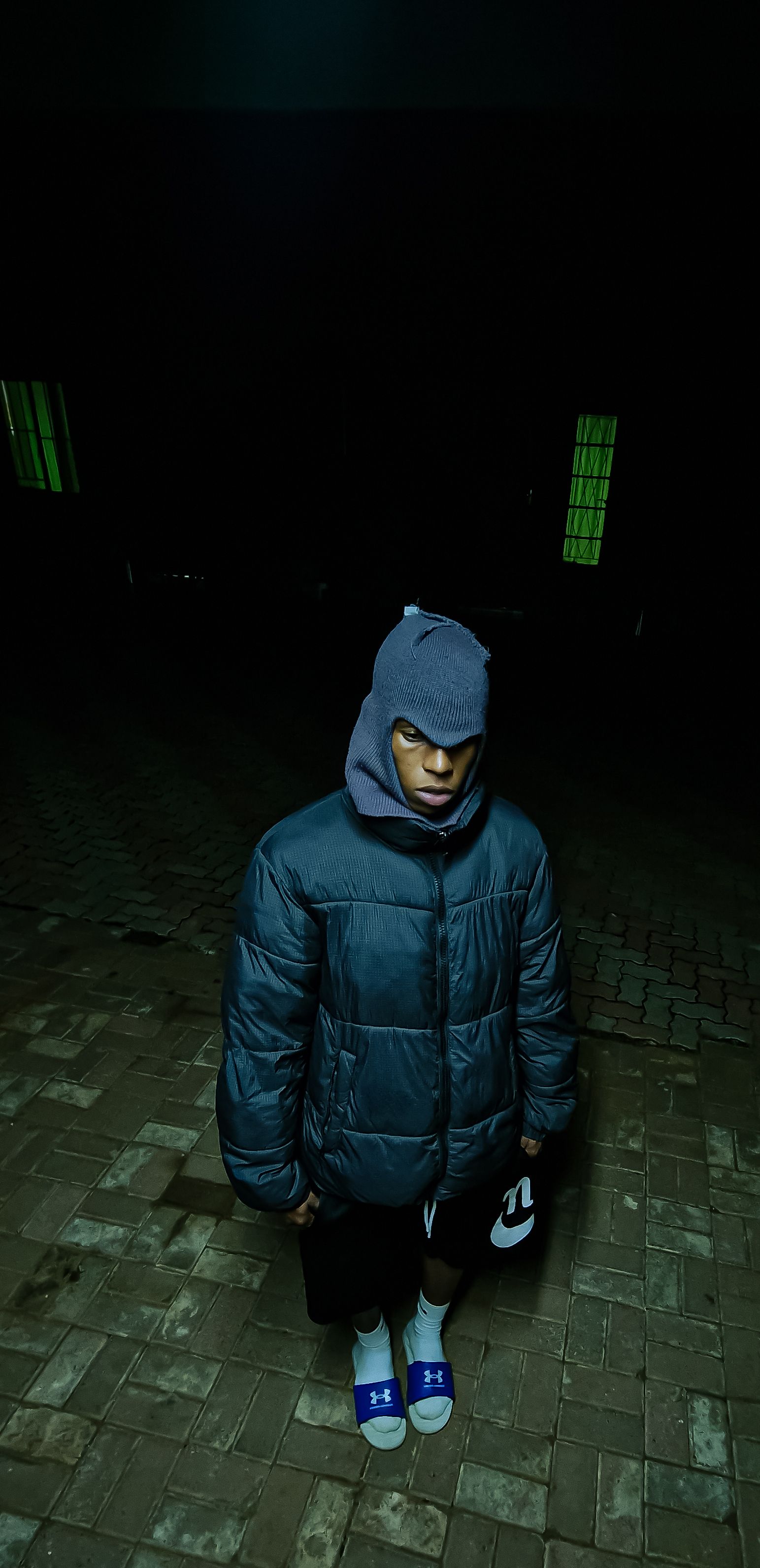 Mysterious Figure in Dark Urban Setting
