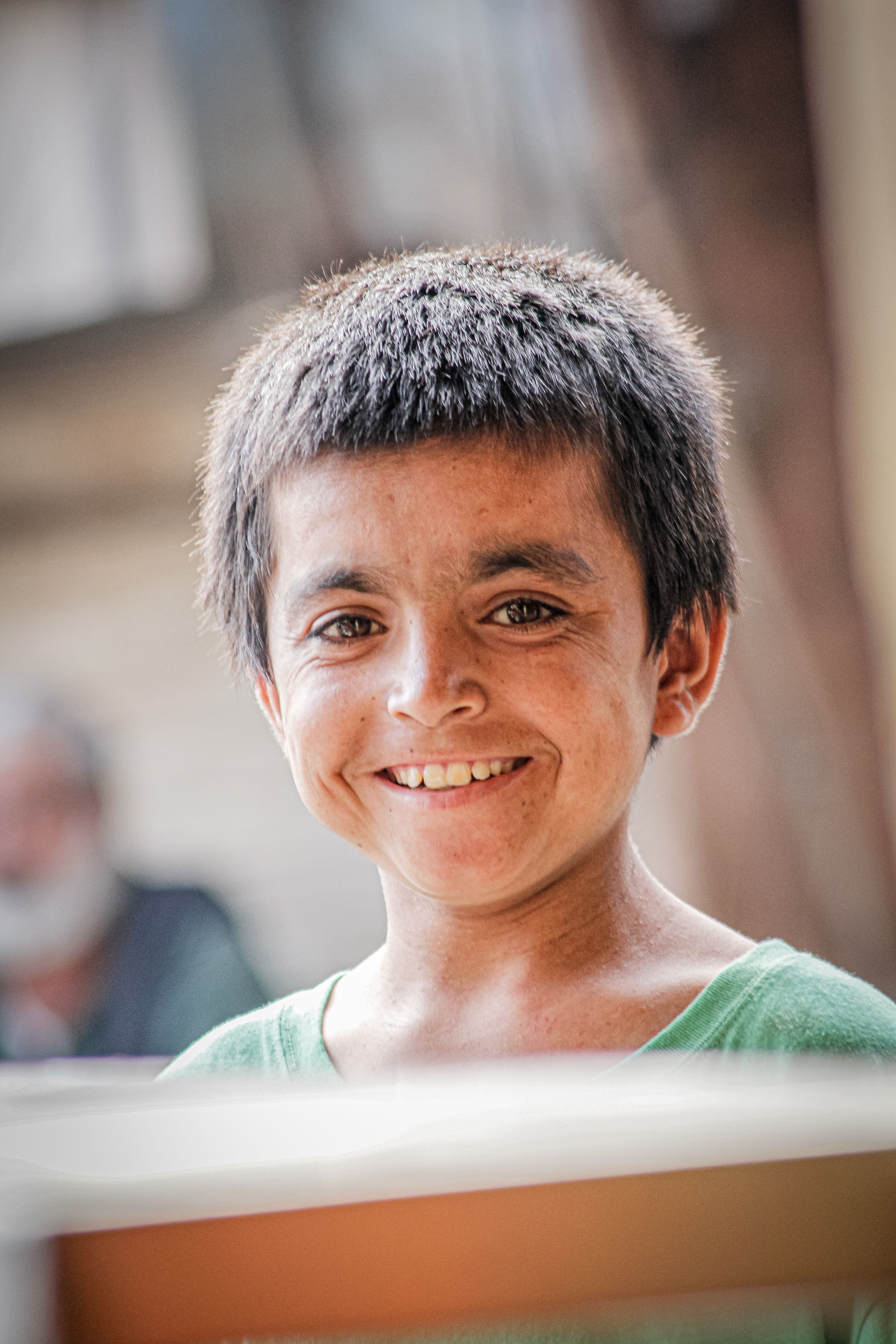 Portrait of a Smiling Young Boy Outdoors · Free Stock Photo