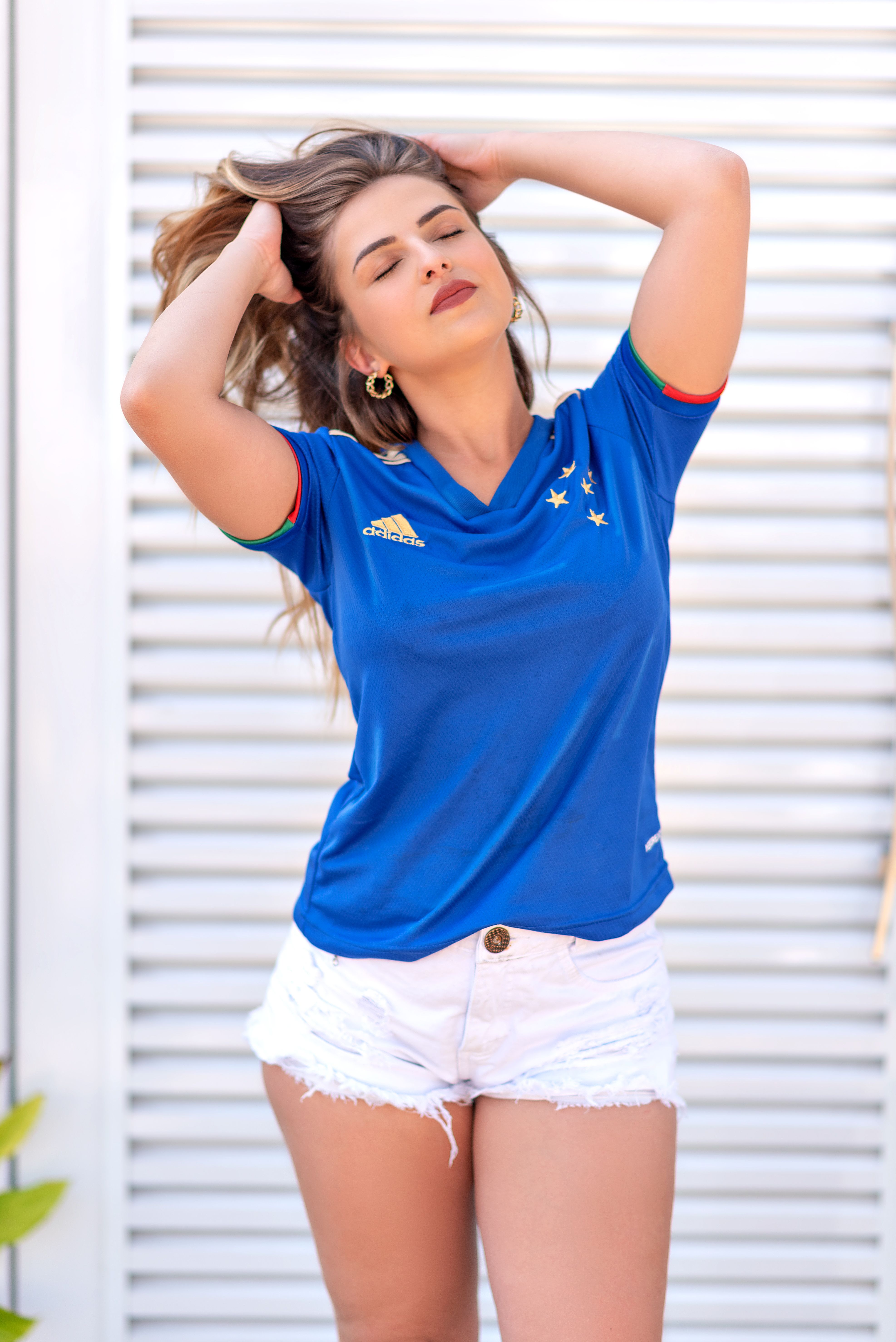 Young Woman Wearing Blue Sports Jersey Outdoors · Free Stock Photo