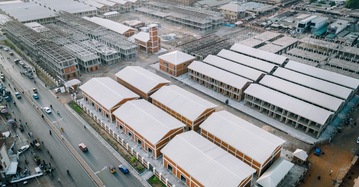 Aerial view of Ho, Ghana, with a large modern building standing out among smaller structures
