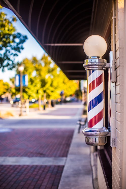 Shallow Focus Photo of Barber's Pole