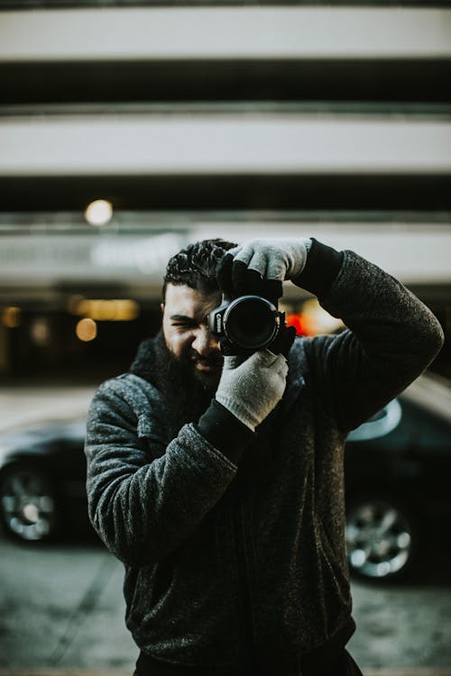 Free Photo Of Person Holding Camera Stock Photo