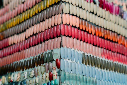 Vibrant array of nail polish colors neatly arranged on display in a beauty salon.