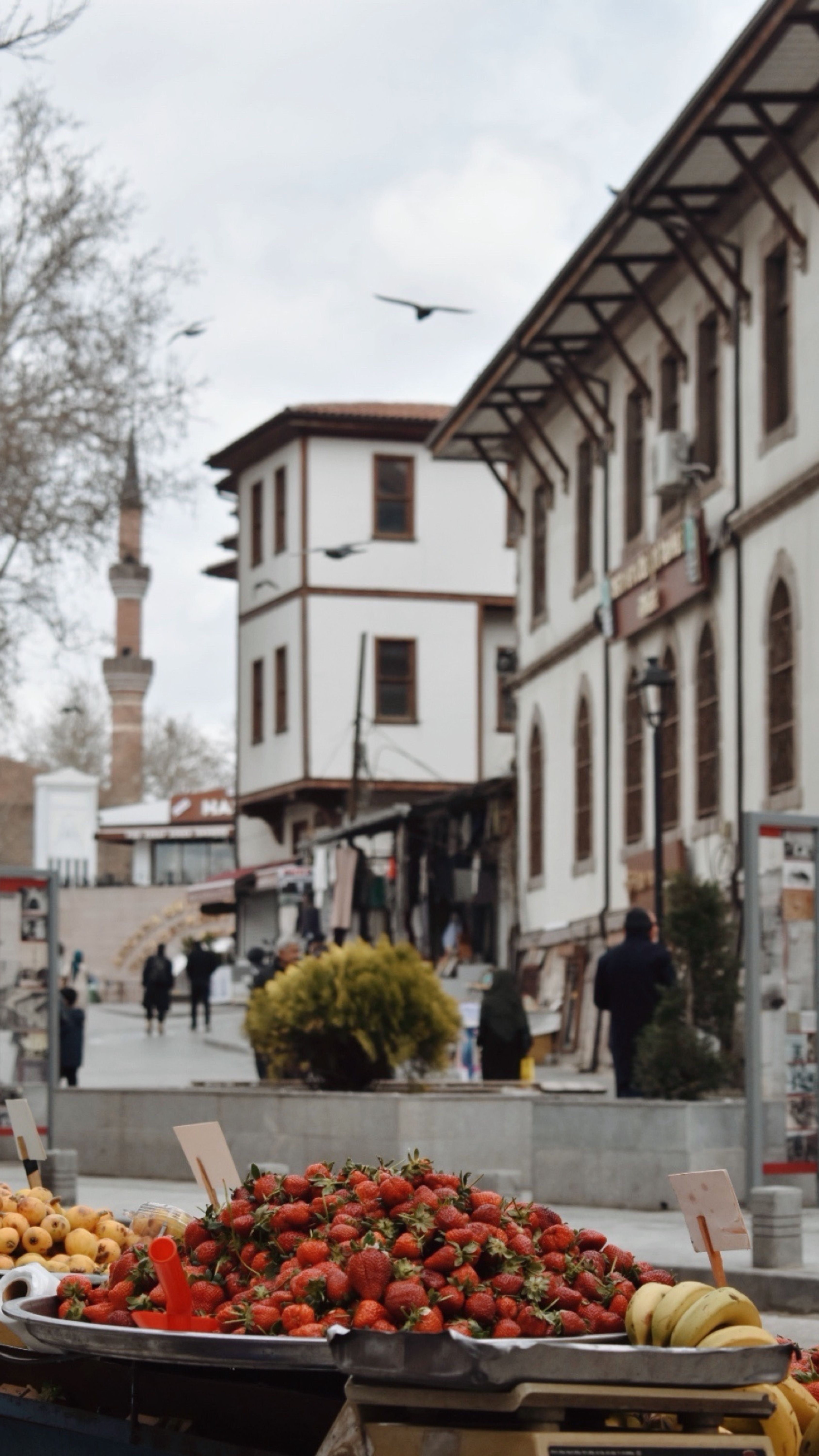 Vibrant street market with historic architecture in a cultural city.