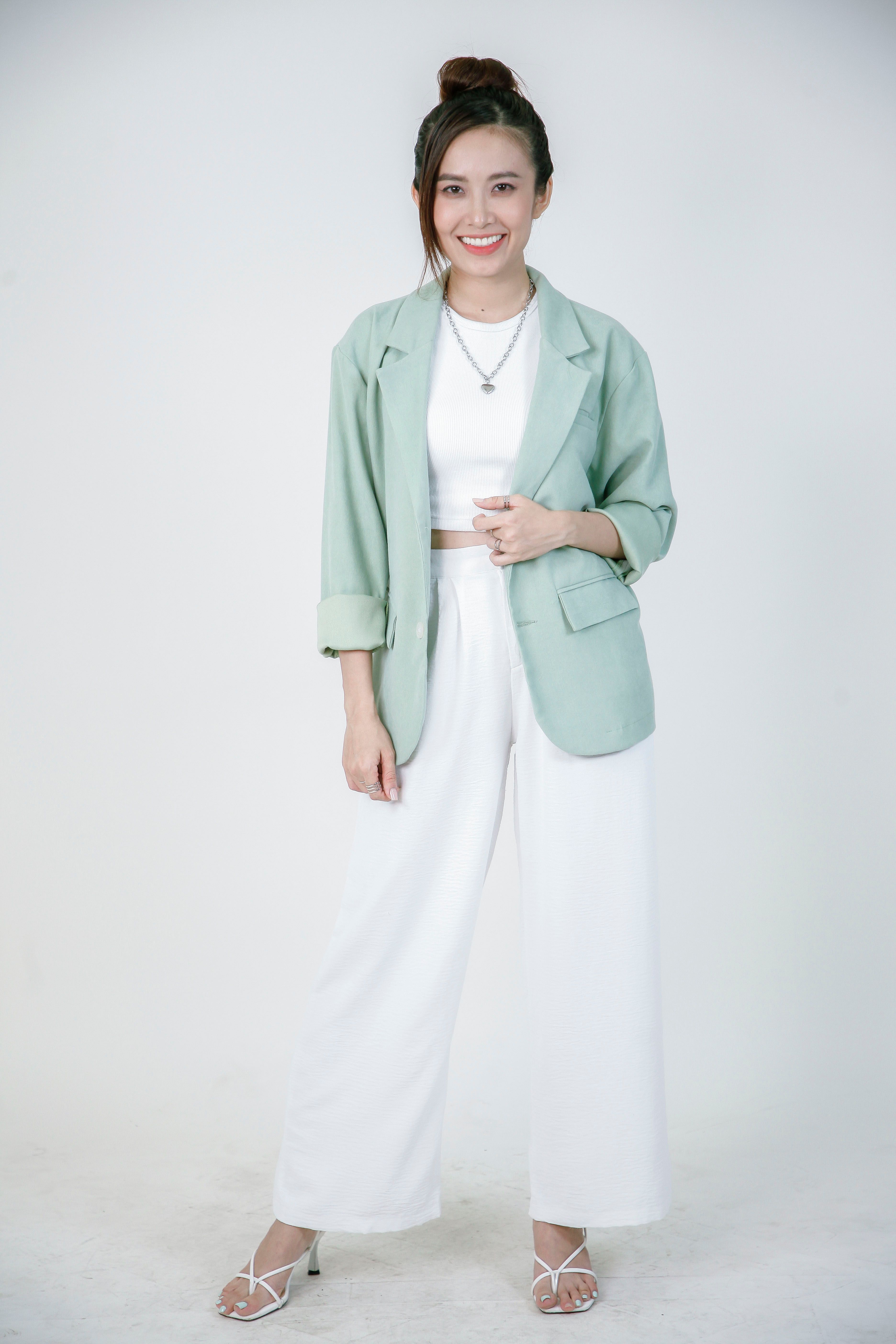 Style inspiration: an olive blazer with cream trousers, not a generated try-on