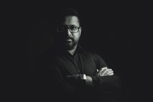 Free Stylish black and white portrait of a man wearing glasses and a watch, exuding confidence. Stock Photo