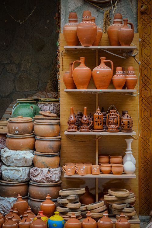 Free A variety of handcrafted clay pots and ceramics on display in a historic Konya street market. Stock Photo
