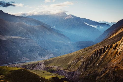 Free Breathtaking landscape of Mount Kazbek and the Caucasus ranges under a cloudy sky. Stock Photo