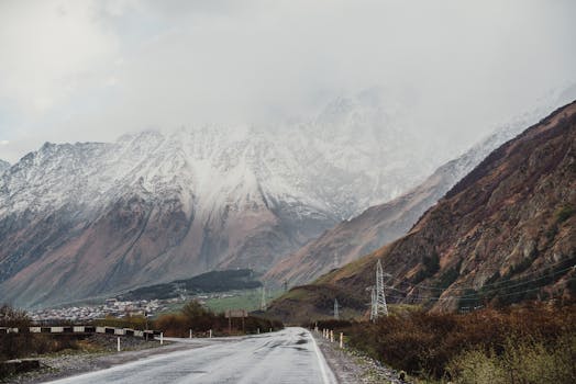 A mesmerizing view of the road leading to the misty Mount Kazbek in Georgia's Mtskheta-Mtianeti region.