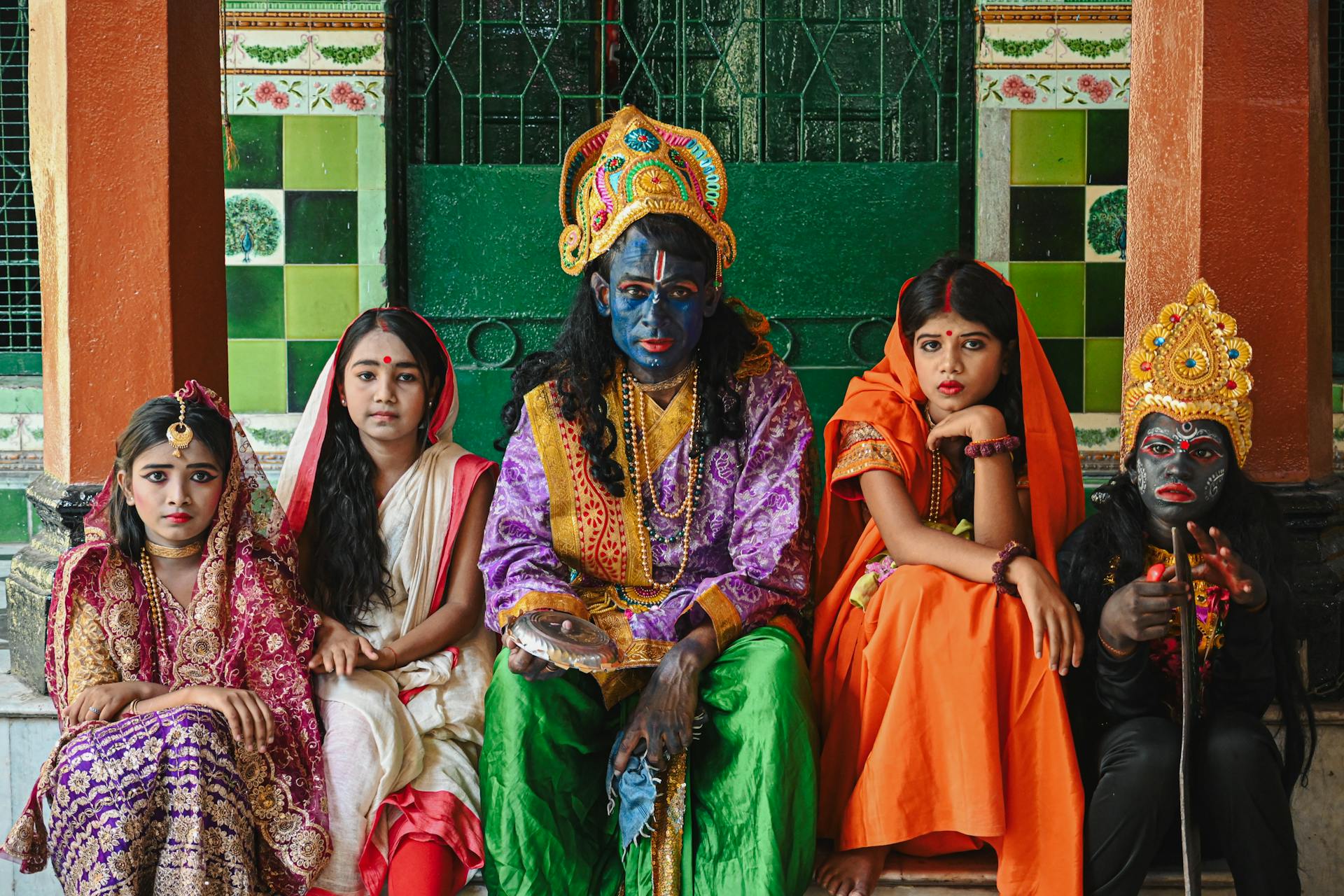 Capture of people in traditional Indian costumes during a cultural festival in Kolkata, India.
