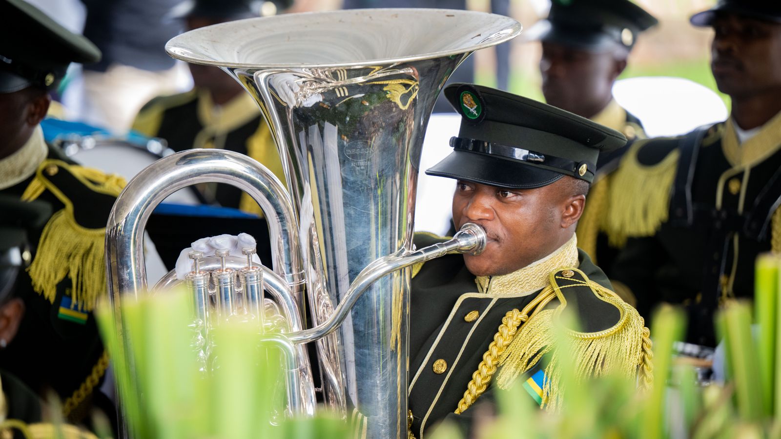 Ceremonial band performance at outdoor event, Mozambique