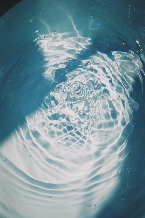Free Beautiful water ripples creating mesmerizing patterns in sunlight, capturing the essence of fluid motion. Stock Photo