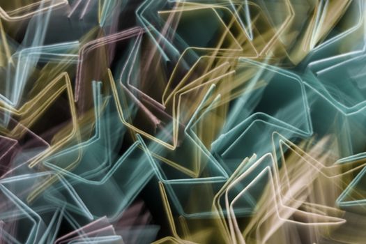 Colorful abstract light streaks forming dynamic patterns with motion blur.