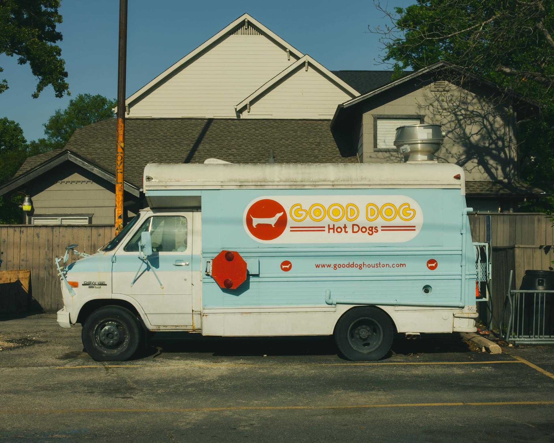 A retro Good Dog Hot Dogs truck parked on a street in Houston, Texas, capturing a vintage vibe.