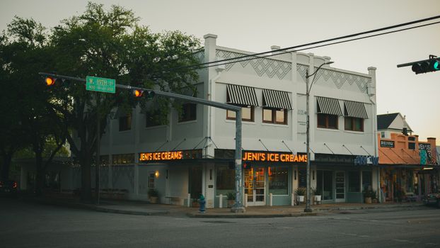 A classic ice cream shop with neon lights under evening sky in Houston, Texas.
