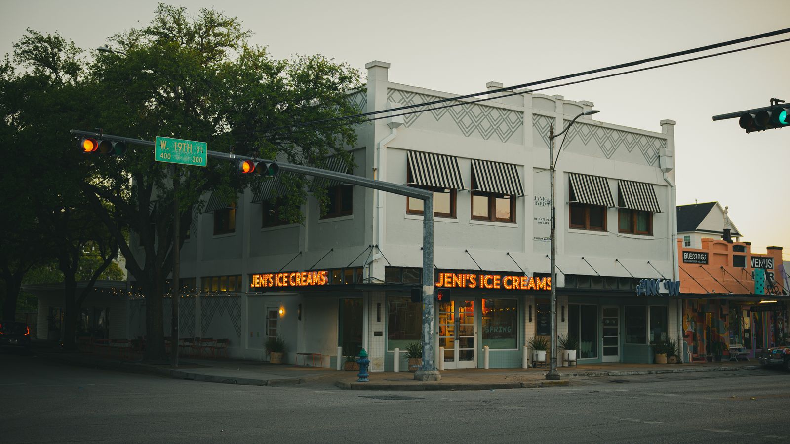 A classic ice cream shop with neon lights under evening sky in Houston, Texas.