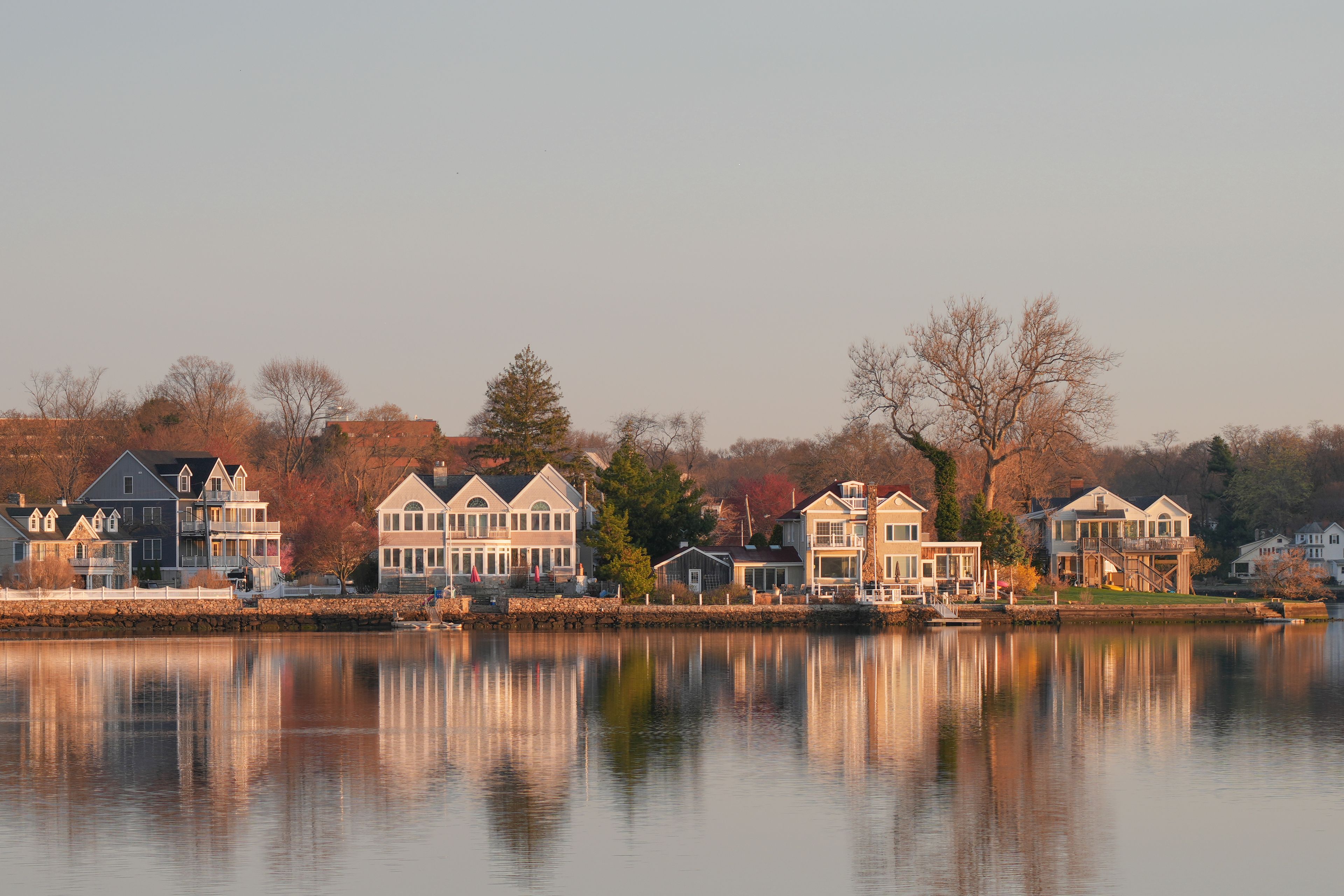 Stamford: Stamford waterfront homes reflected in calm water