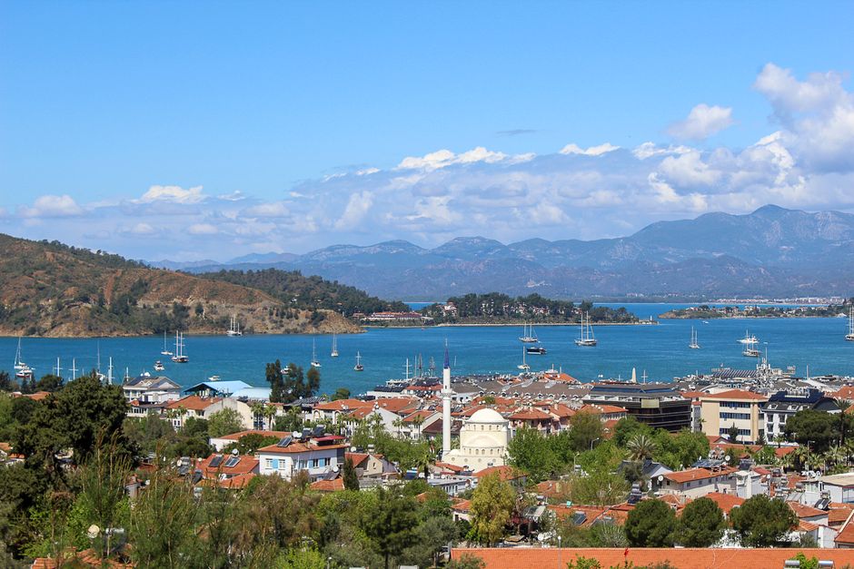 Stunning Fethiye: Quad Bike Off-Road Adventure With Hotel Transfers Review 2026 - Scenic aerial view of Fethiye with its bay, harbor, and mountains under a clear sky.