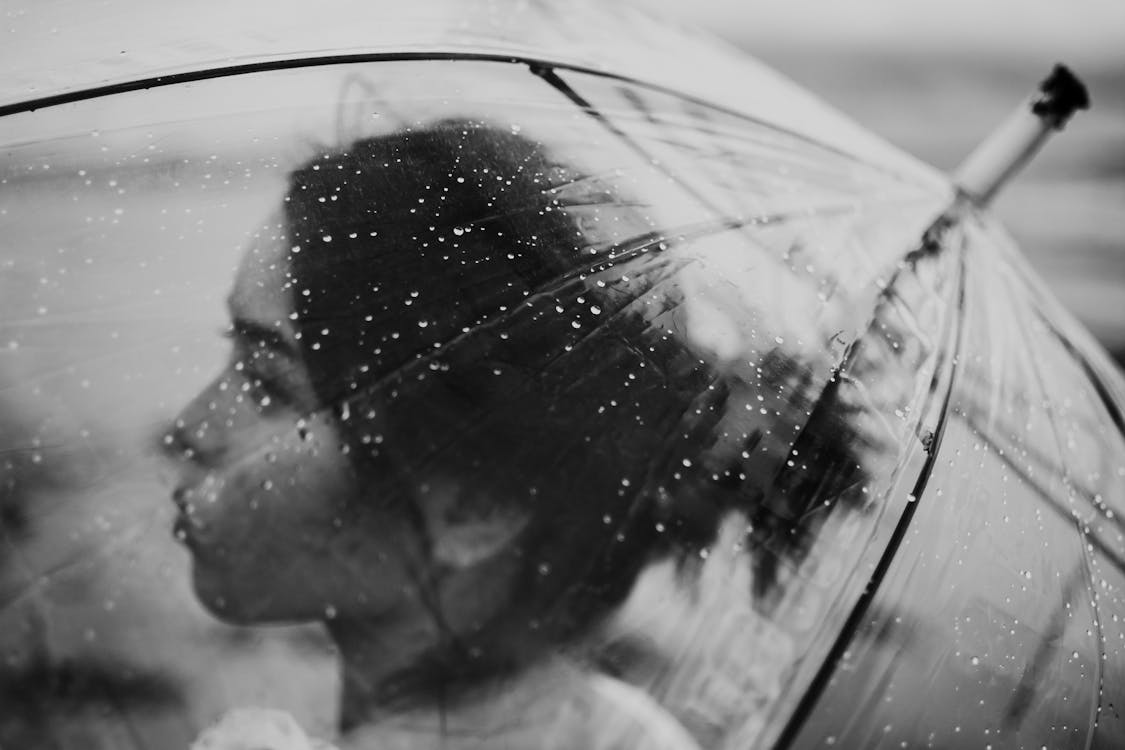 Monochrome Photo Of Woman Holding Umbrella