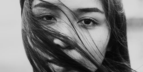 Free Striking black and white portrait of a woman with wind-swept hair. Stock Photo