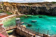 Discover the vibrant azure waters and rocky cliffs of Il-Mellieħa, Malta's charming coastal village.