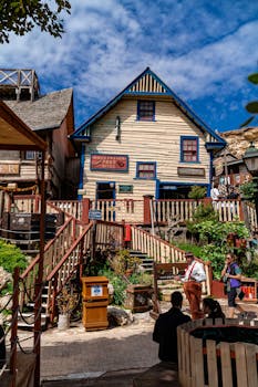 Charming view of Popeye Village, Malta with rustic architecture under a bright sky.
