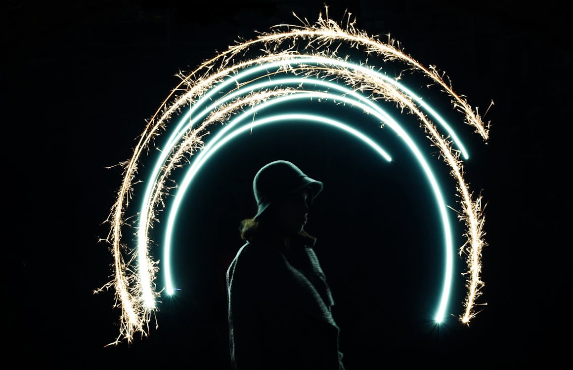 Free Time lapse Photo Of Semi-Circle Light Painting With A Woman In The Center Stock Photo