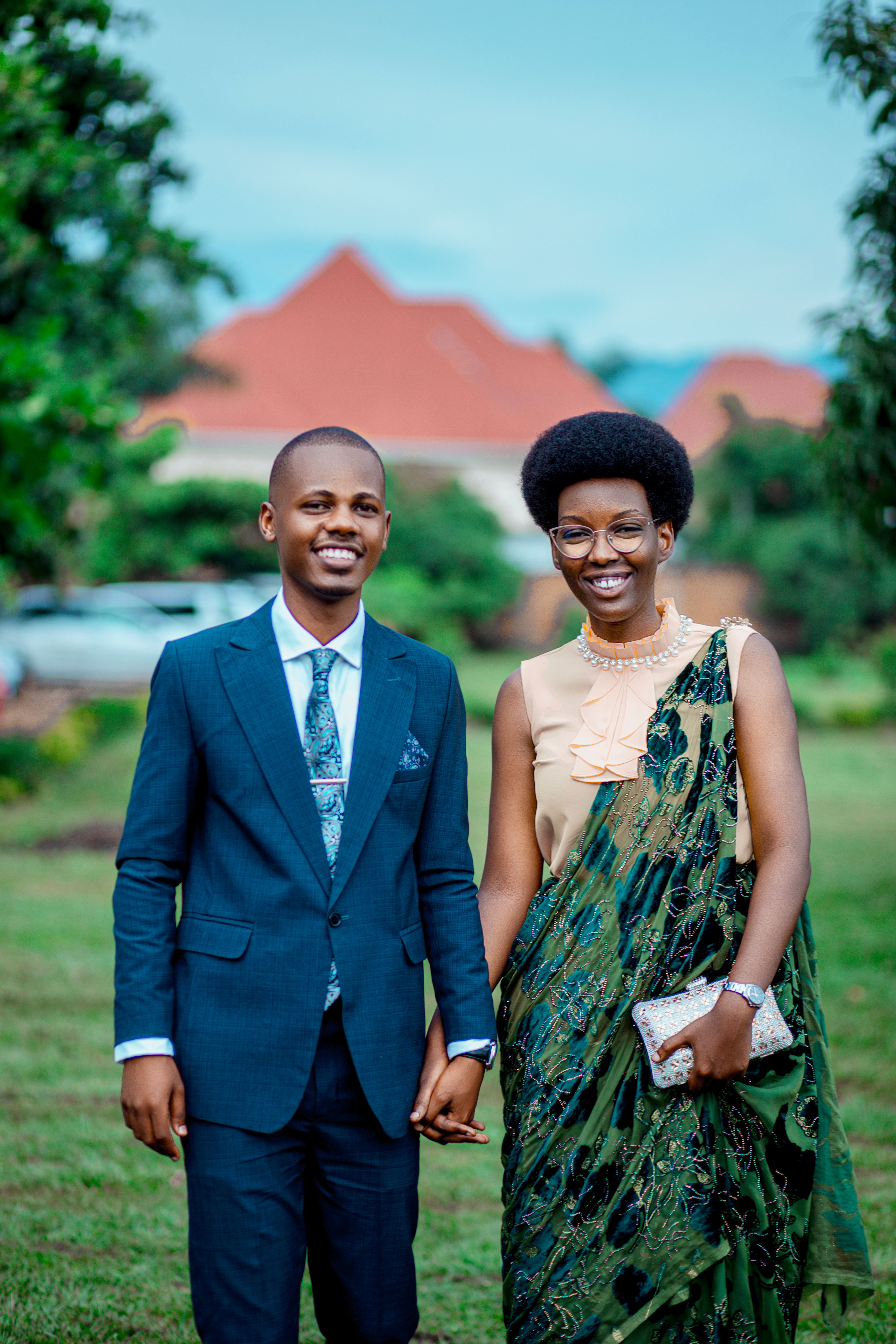 Elegant Couple Holding Hands Outdoors · Free Stock Photo