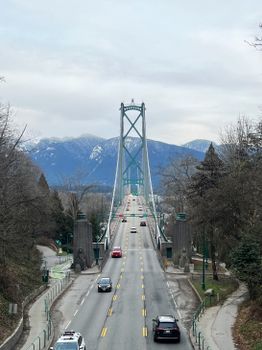 Lions Gate Bridge with mountain backdrop in Vancouver, British Columbia.