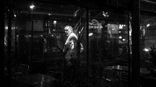 Free Captivating black and white street photography capturing urban life in Buenos Aires at night. Stock Photo