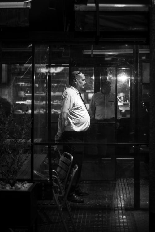 Free Atmospheric black and white photo capturing urban life at night in Buenos Aires. Stock Photo