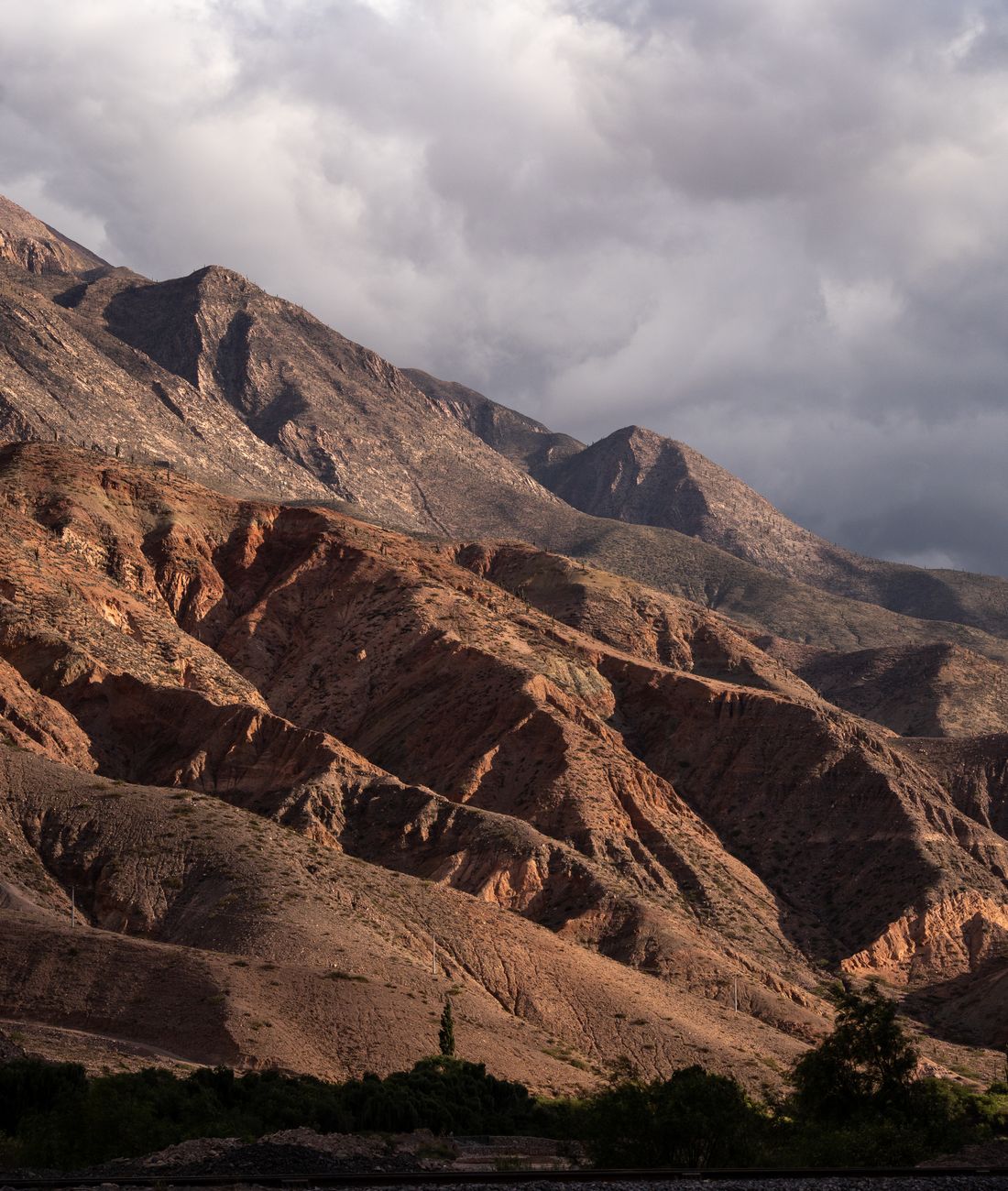Deep red eroded ravine walls in the Cinti valley