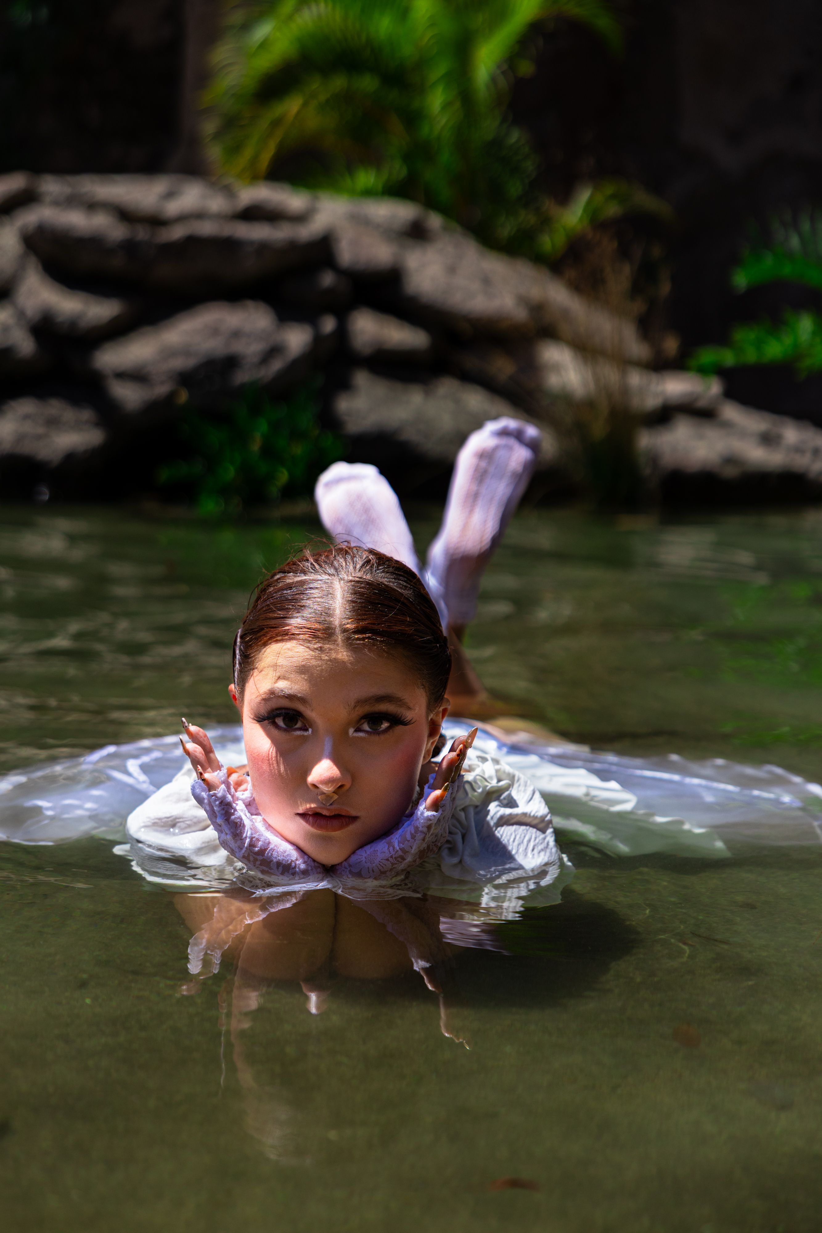 Young Woman in Water with Dramatic Lighting · Free Stock Photo